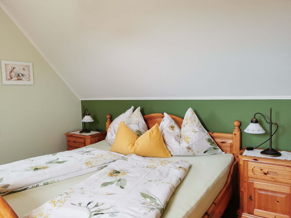 Schlafzimmer der Ferienwohnung Presse im Obergeschoss auf dem Ofenmacherhof